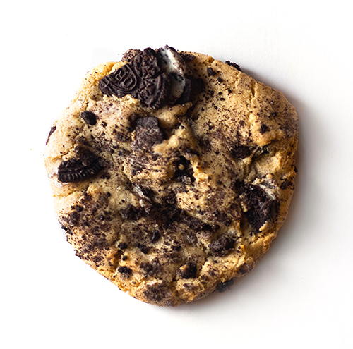 single cookies and cream cookie on white background