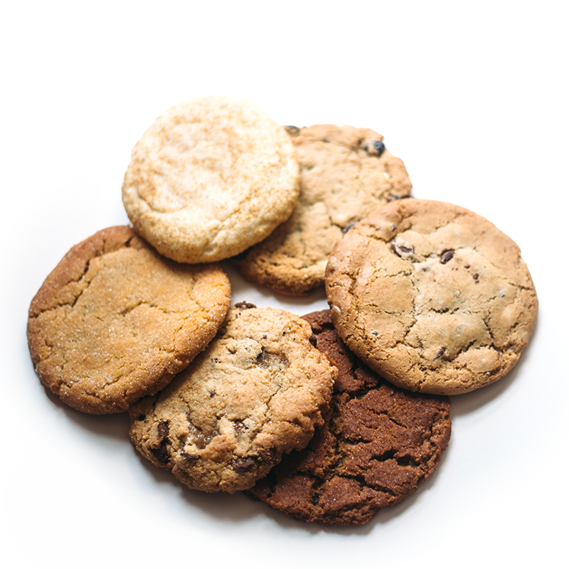 half dozen small package cookies on white background